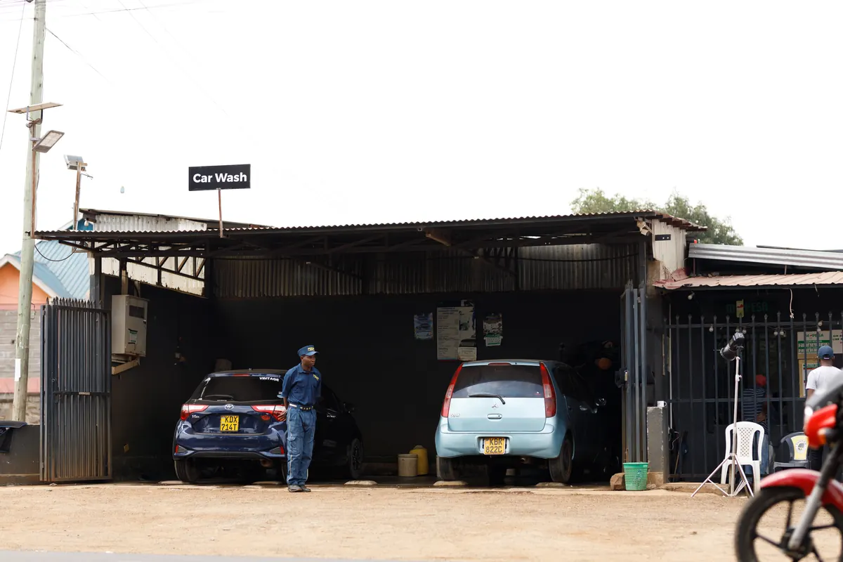 Car wash attendant at the wash bay