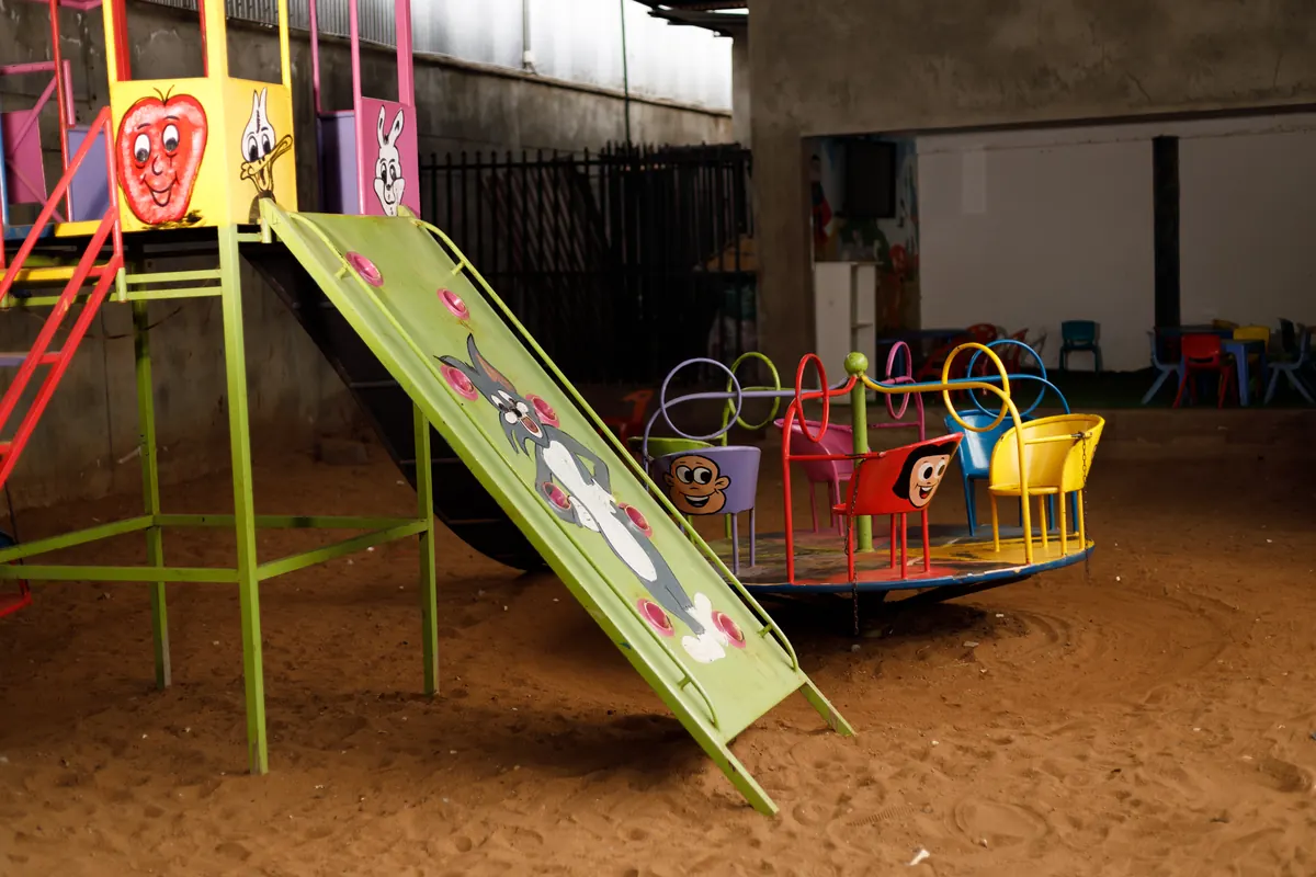 Outdoor playground with slide and merry-go-round